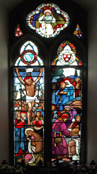 Chancel window depicting the crucifixion and burial of Jesus